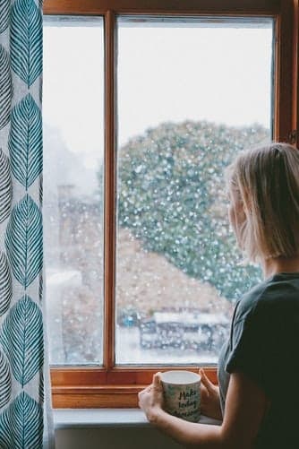 Woman in front of window in winter